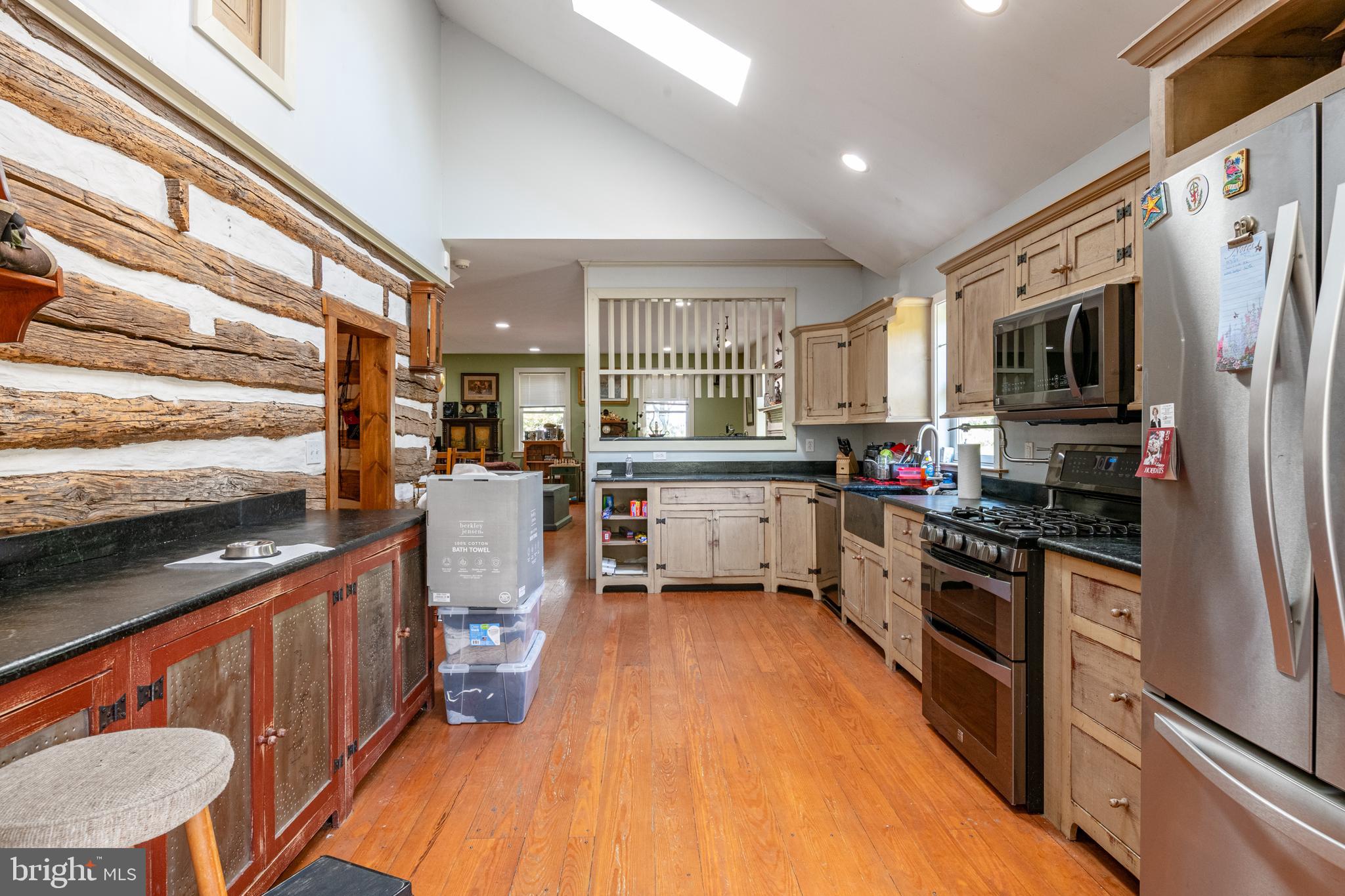 700 Fabers Road Reading, PA 19606 - Photo 11 of 33 a kitchen with stainless steel appliances a stove a sink dishwasher a refrigerator white cabinets and wooden floor