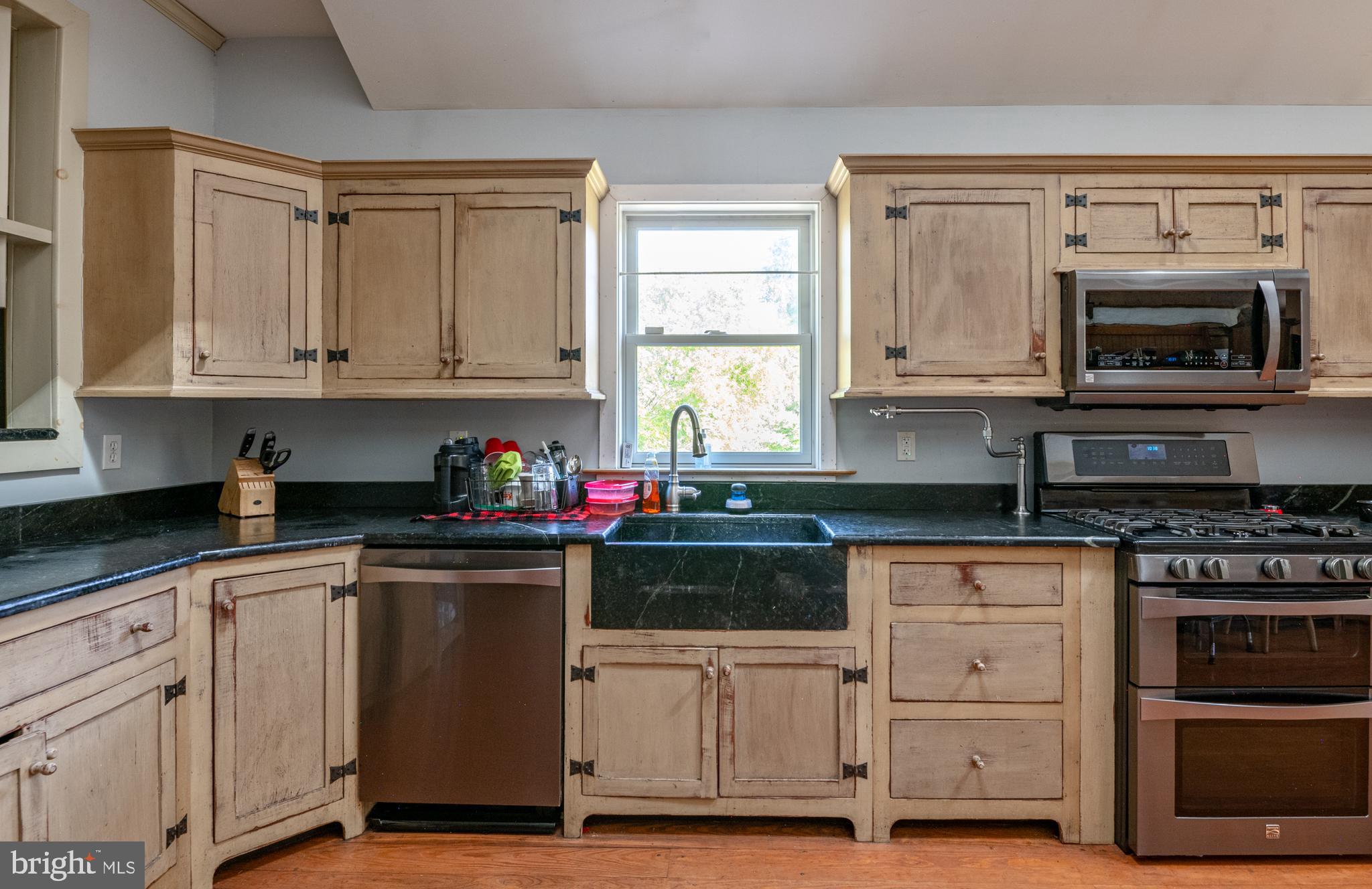 700 Fabers Road Reading, PA 19606 - Photo 13 of 33 a kitchen with granite countertop cabinets stainless steel appliances and a window