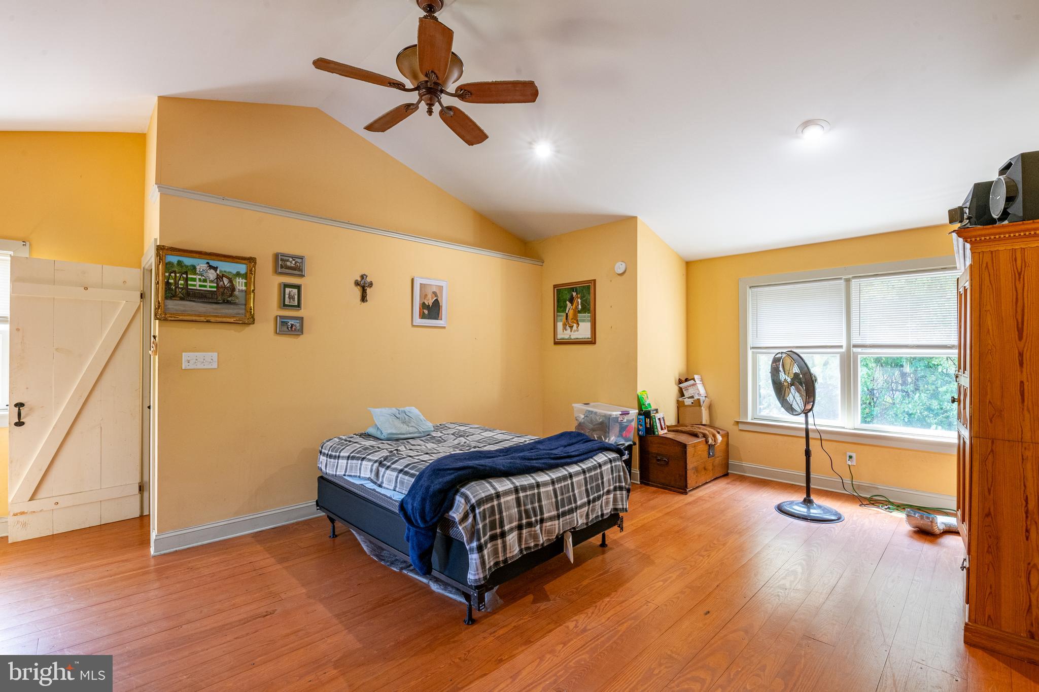700 Fabers Road Reading, PA 19606 - Photo 18 of 33 a bedroom with a bed and wooden floor