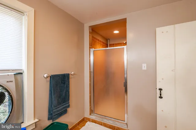 a view of a hallway with washer and dryer