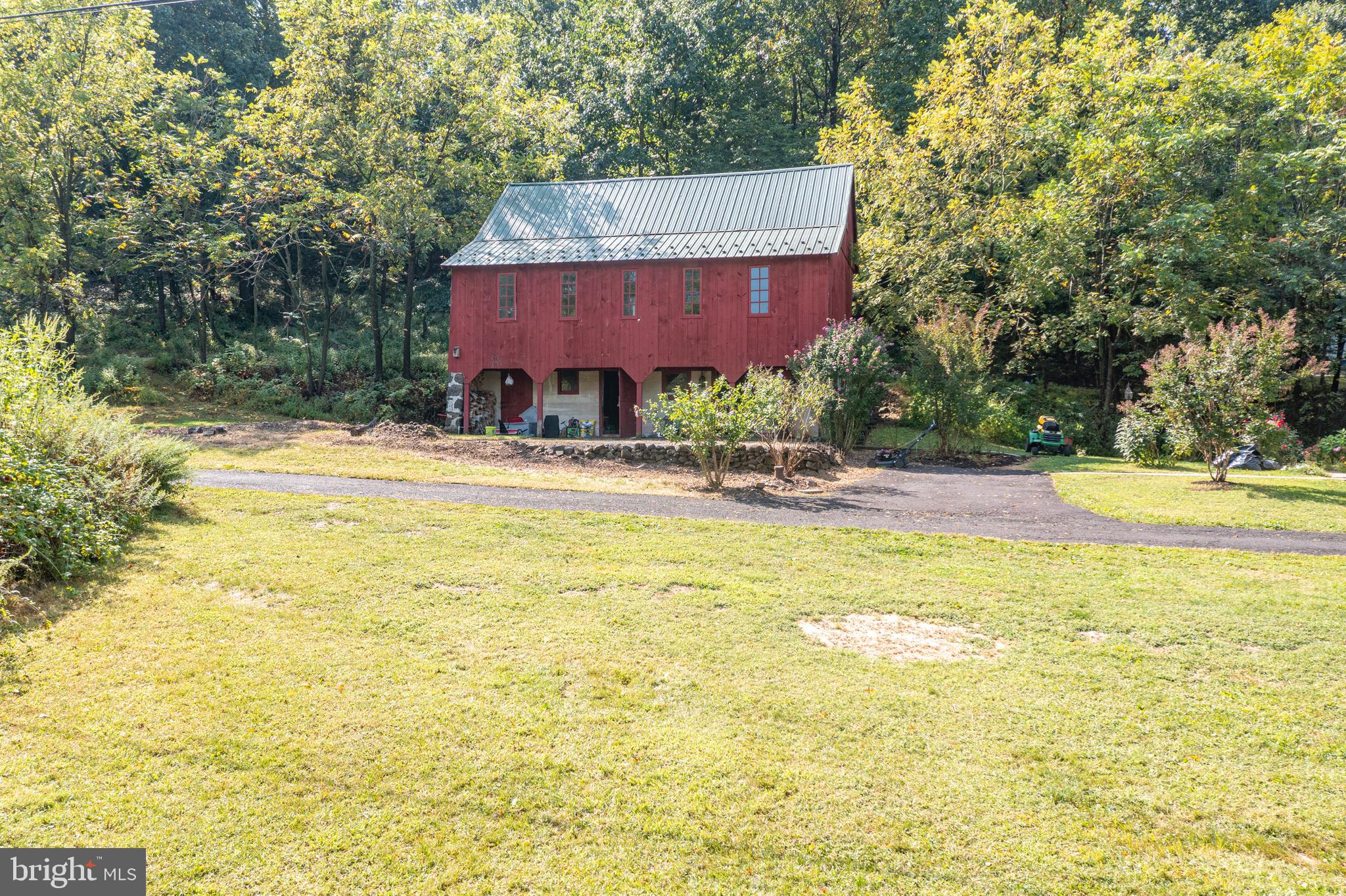 700 Fabers Road Reading, PA 19606 - Photo 29 of 33 a view of a swimming pool with a lawn chairs under an umbrella