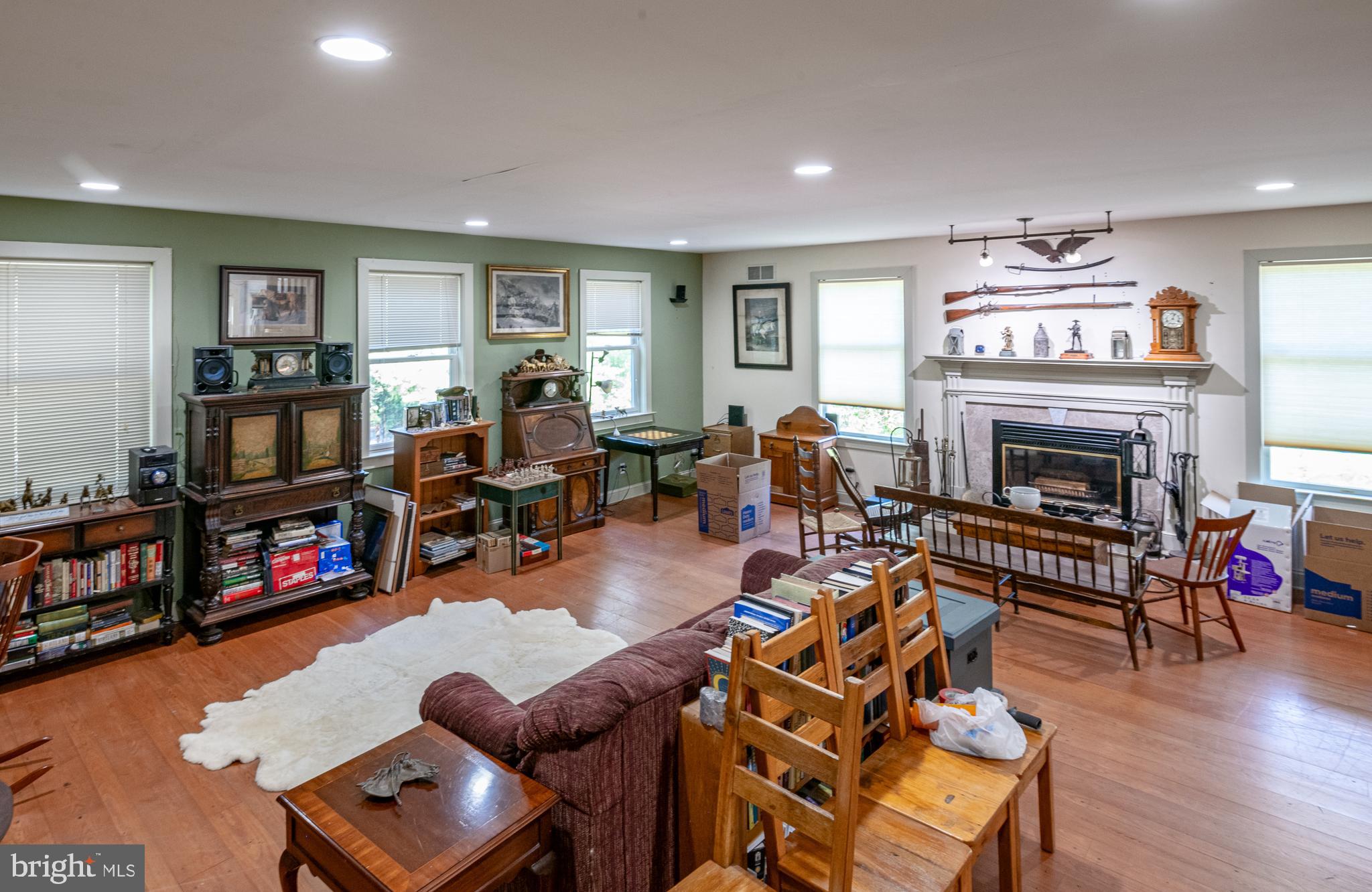 700 Fabers Road Reading, PA 19606 - Photo 6 of 33 a living room with furniture a fireplace and a flat screen tv