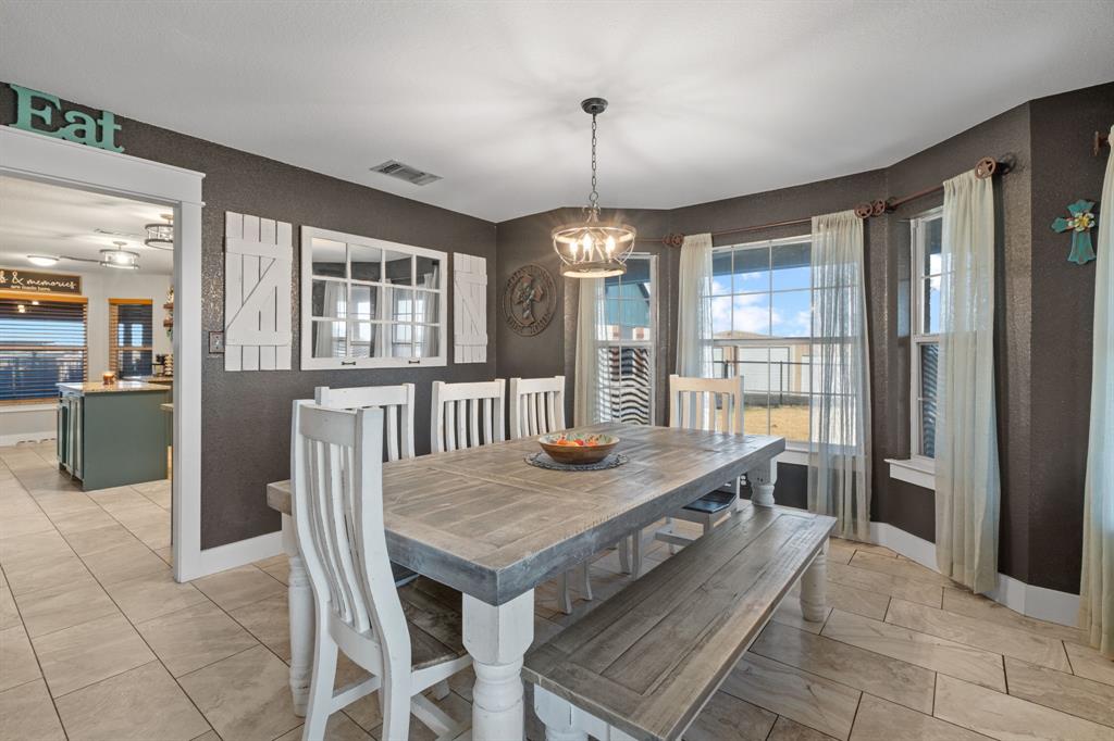 4320 Farm To Market 920 Weatherford, TX 76088 - Photo 4 of 39 a view of a dining table and chairs in a room