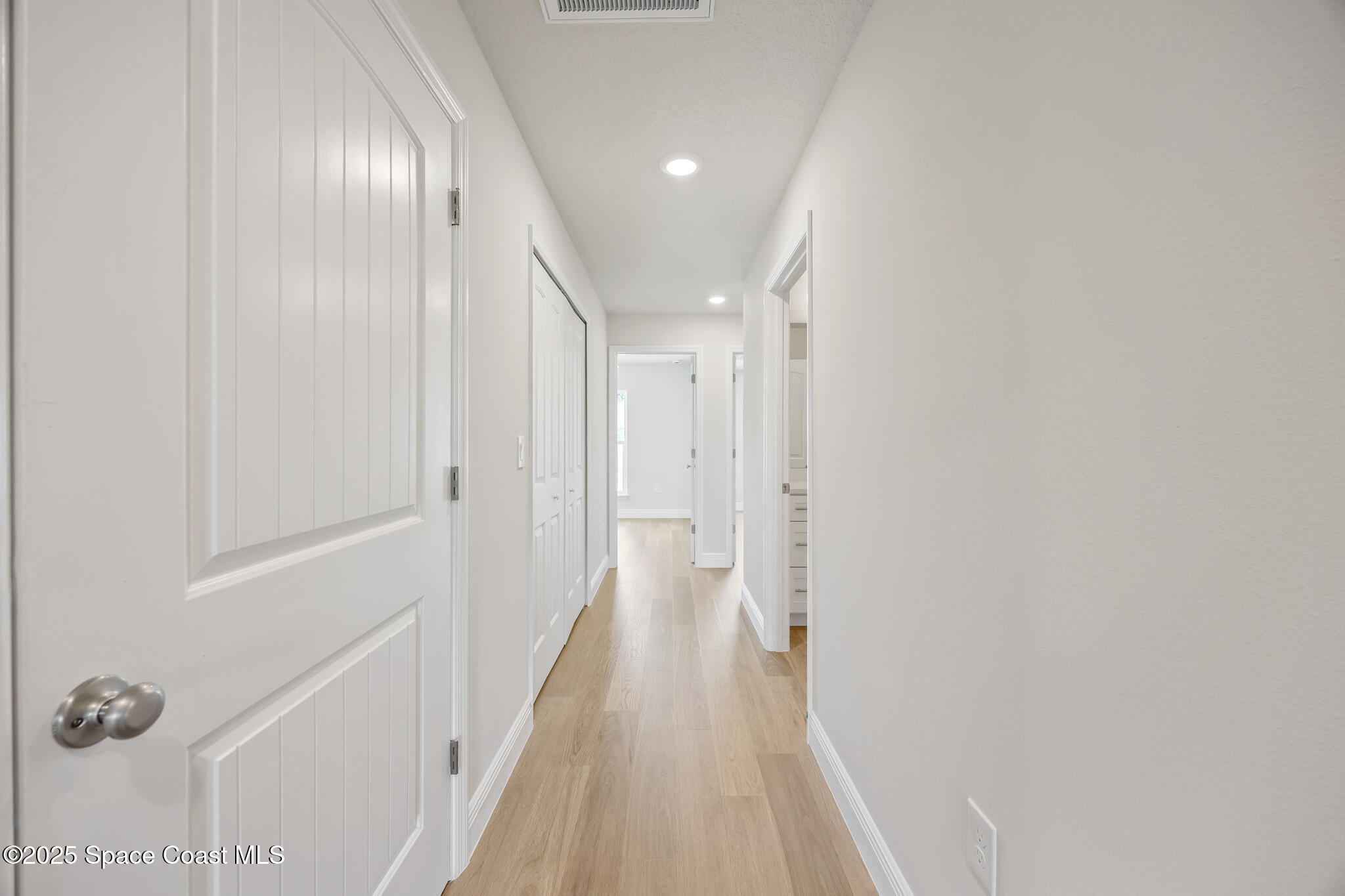 178 Hidden Wds Place Melbourne, FL 32901 - Photo 21 of 24 a view of a hallway with wooden floor
