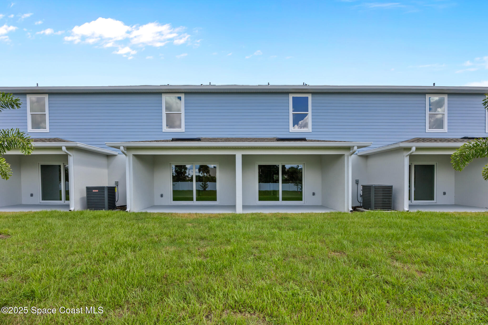 178 Hidden Wds Place Melbourne, FL 32901 - Photo 23 of 24 a front view of a brick house with a yard