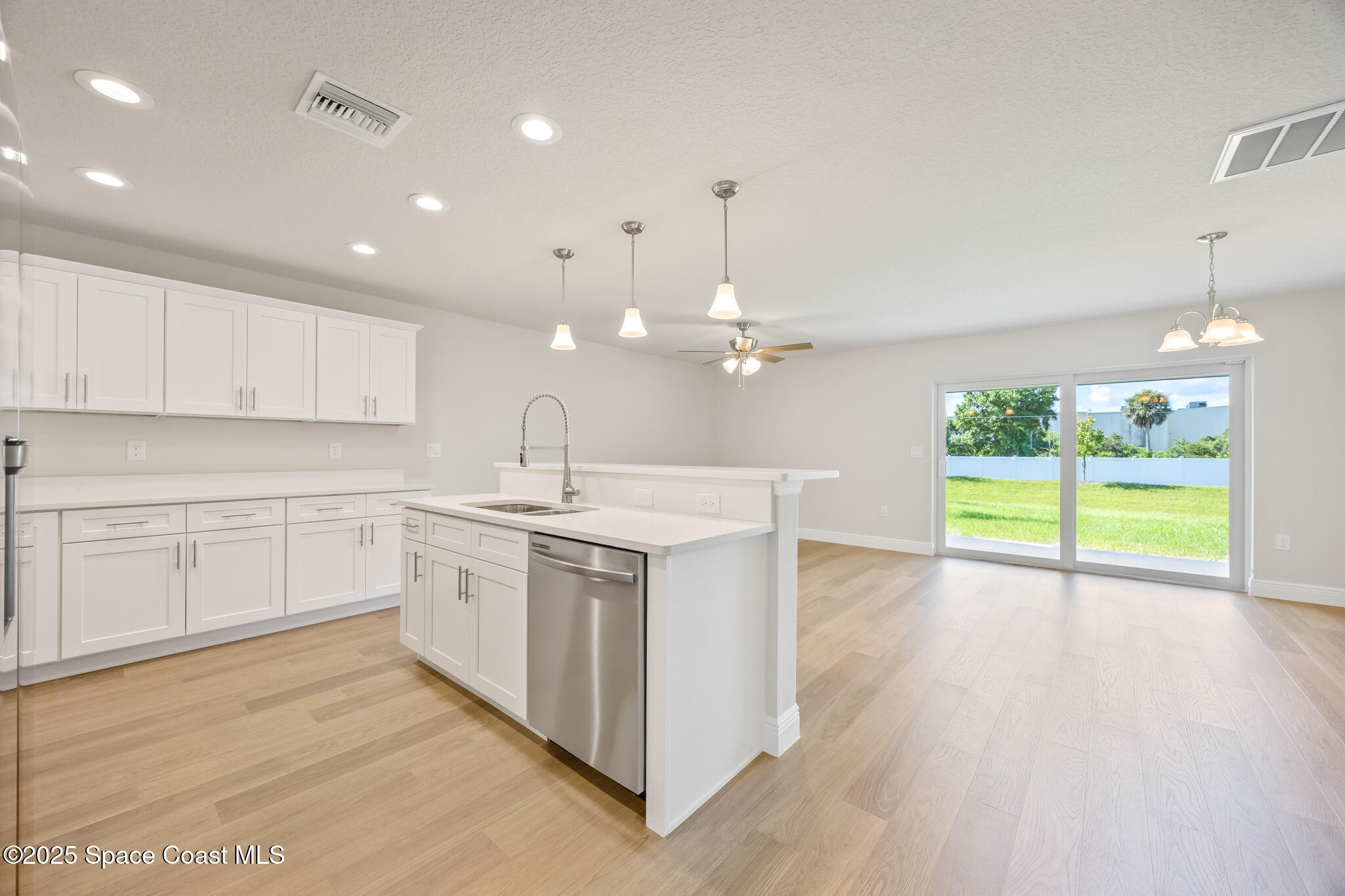 178 Hidden Wds Place Melbourne, FL 32901 - Photo 5 of 24 a kitchen with a sink and window