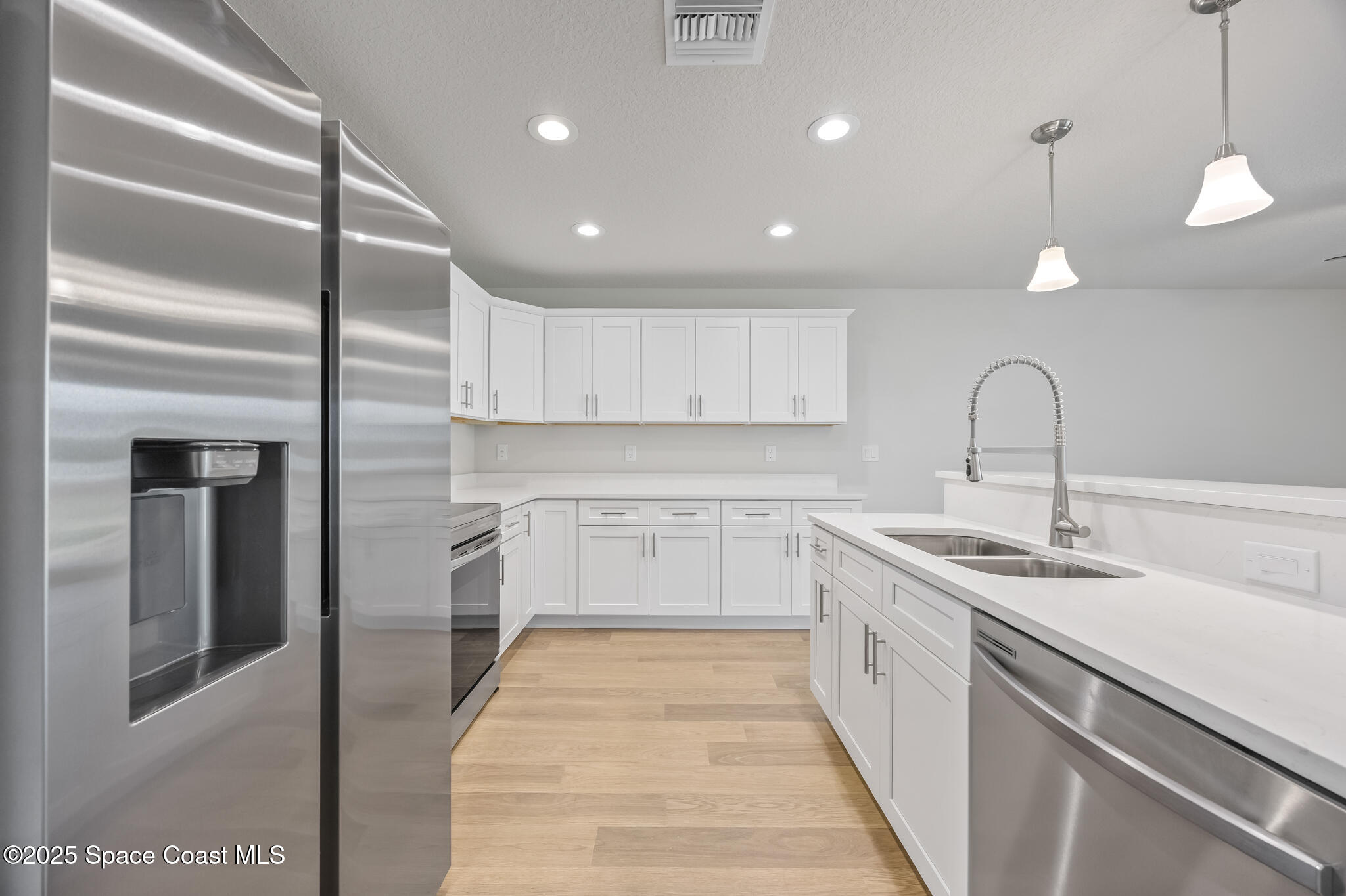 178 Hidden Wds Place Melbourne, FL 32901 - Photo 6 of 24 a kitchen with a sink and cabinets