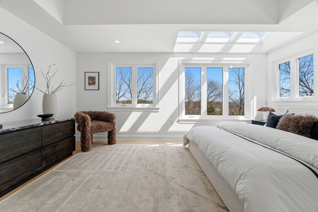 171 Shaw Road Brookline, MA 02467 - Photo 29 of 42 a bedroom with a large bed and a window