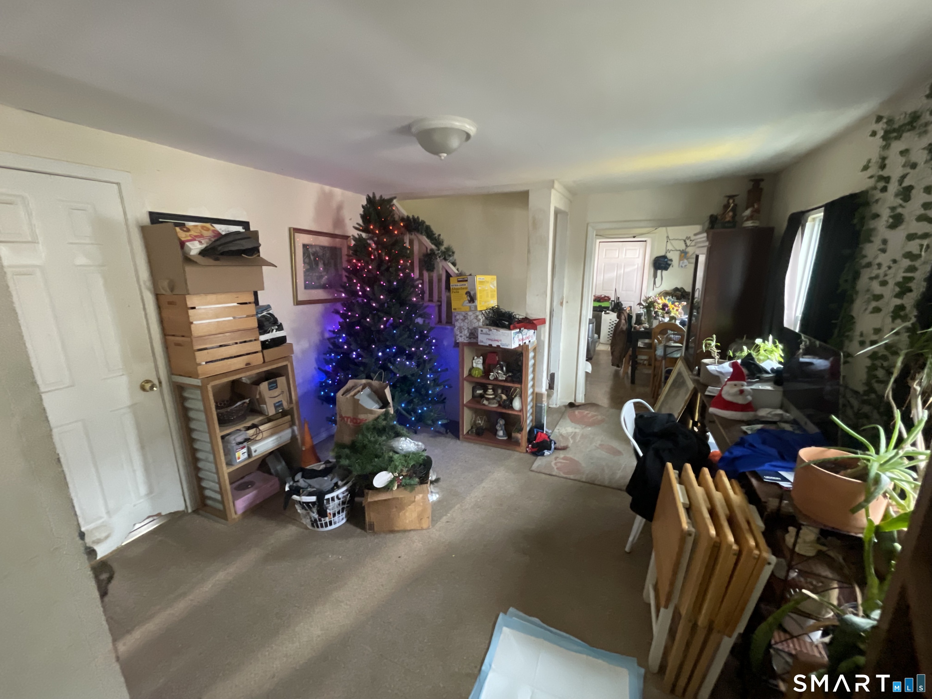 40 Grove Street Ansonia, CT 06401 - Photo 3 of 21 a view of a livingroom with furniture and a garage
