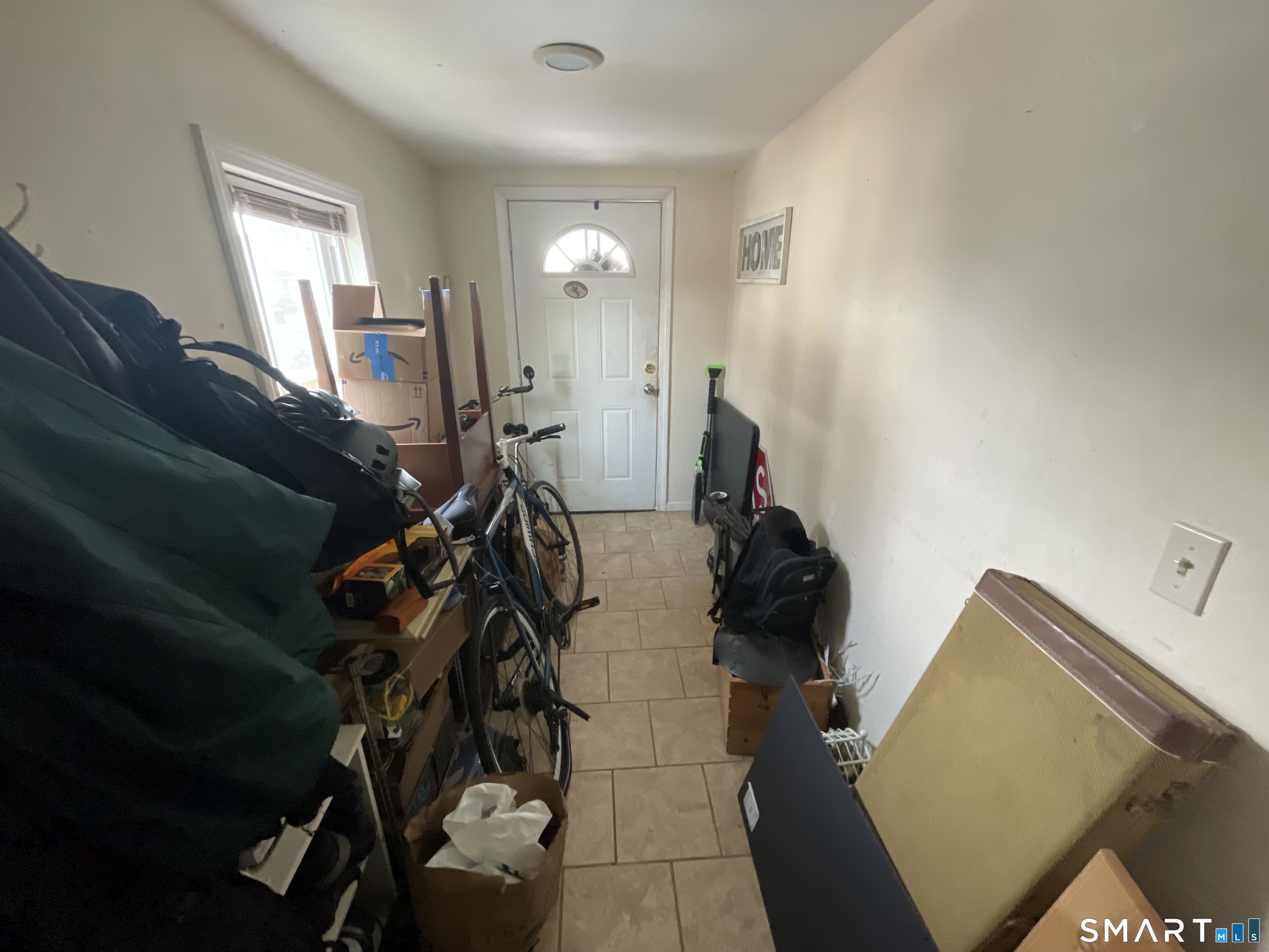 40 Grove Street Ansonia, CT 06401 - Photo 4 of 21 a view of a livingroom with furniture and windows