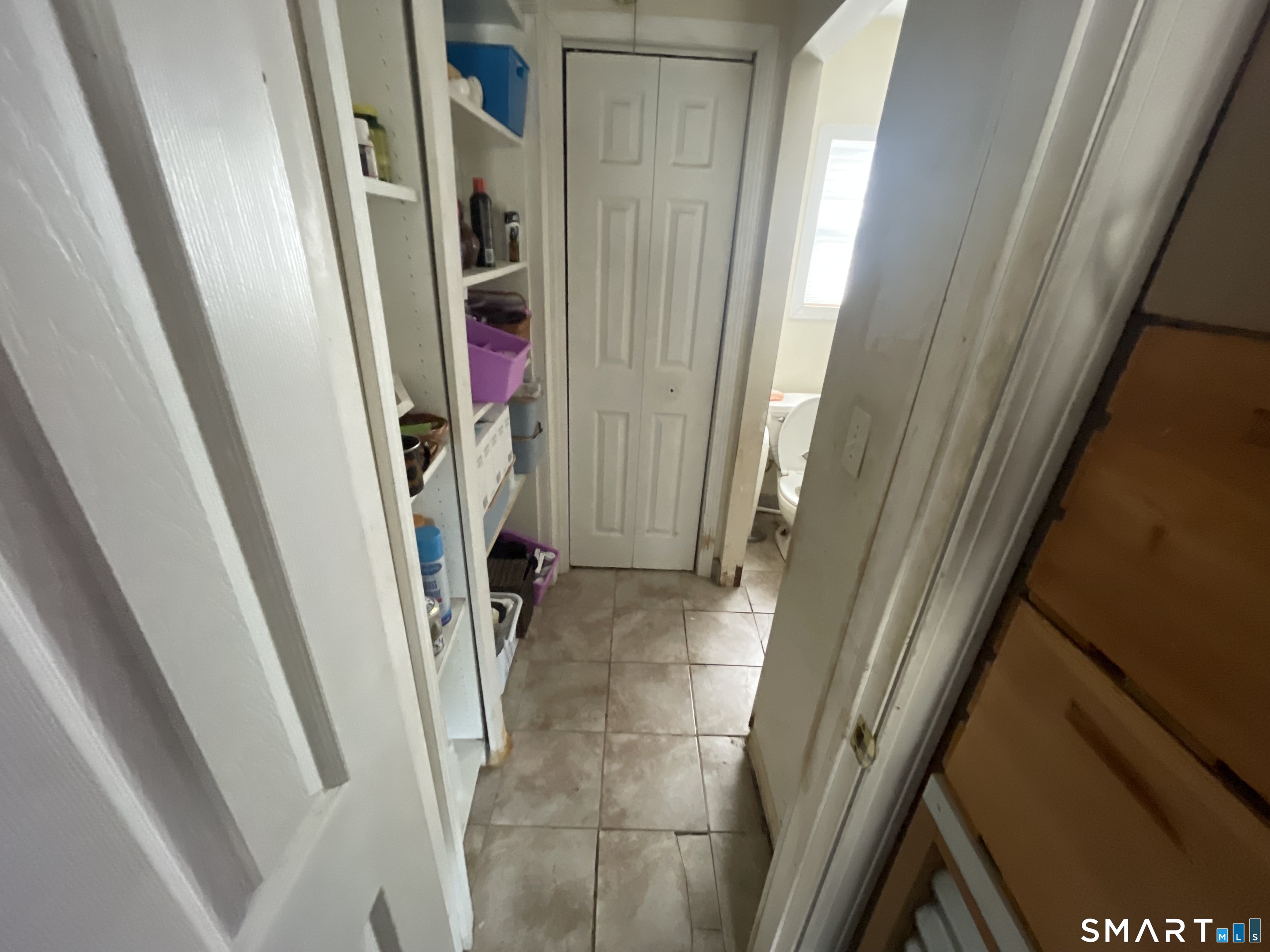 40 Grove Street Ansonia, CT 06401 - Photo 5 of 21 a view of walk in closet with furniture