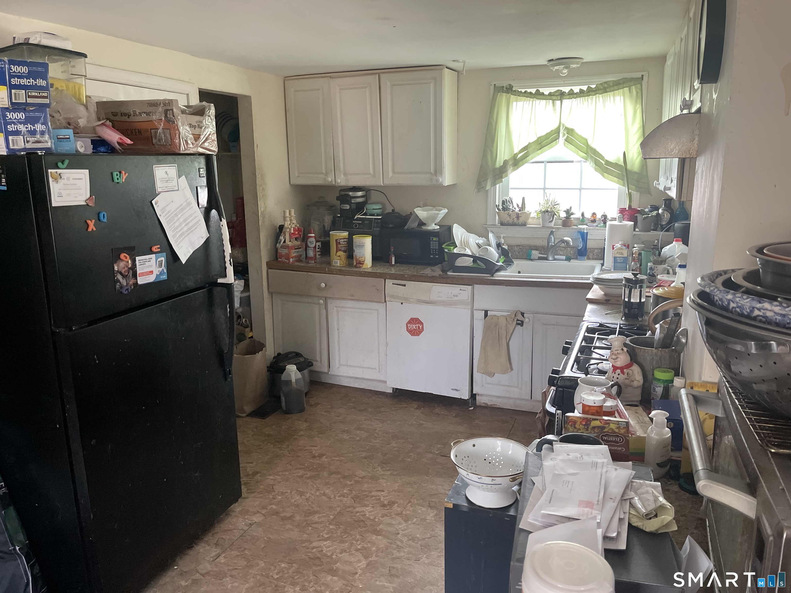 40 Grove Street Ansonia, CT 06401 - Photo 8 of 21 a room with furniture a flat screen tv and a window