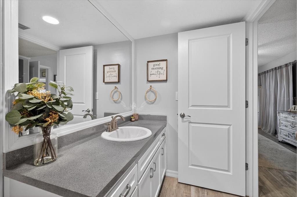 3230 Teeside Drive New Port Richey, FL 34655 - Photo 20 of 32 a bathroom with a sink double vanity and a mirror