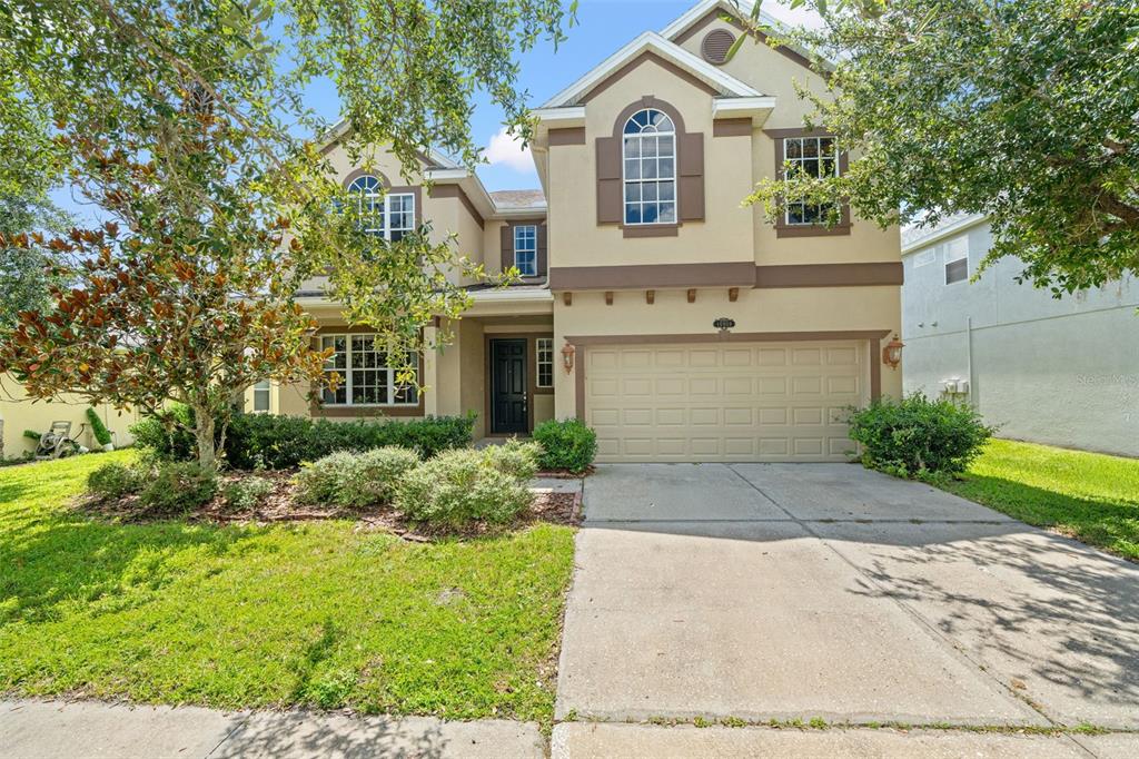 10909 Observatory Way Tampa, FL 33647 - Photo 1 of 1 a front view of a house with garden