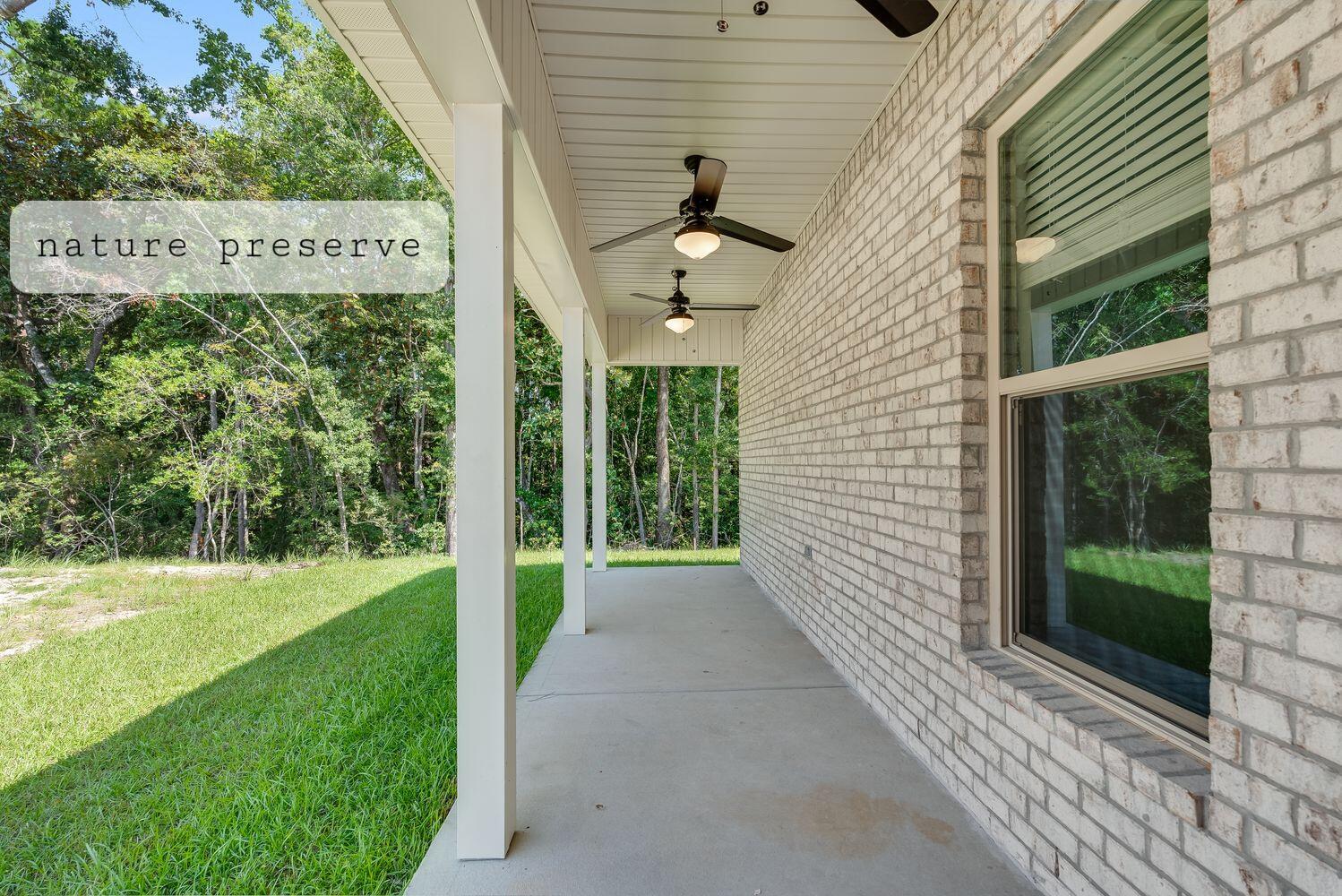 77 Eclipse Loop Freeport, FL 32439 - Photo 3 of 31 a view of a pathway with a yard