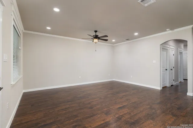 a view of a kitchen with a sink and a refrigerator