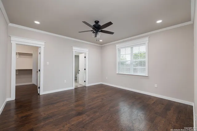 a bathroom with a granite countertop sink a mirror and shower