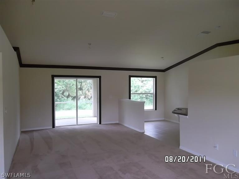 333 Delaware Road Lehigh Acres, FL 33936 - Photo 7 of 14 a view of empty room with windows