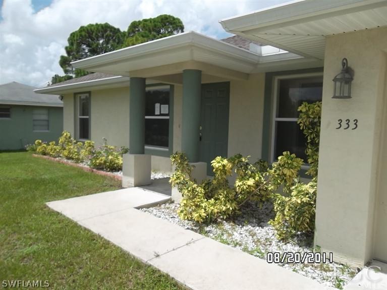 333 Delaware Road Lehigh Acres, FL 33936 - Photo 10 of 14 a front view of a house