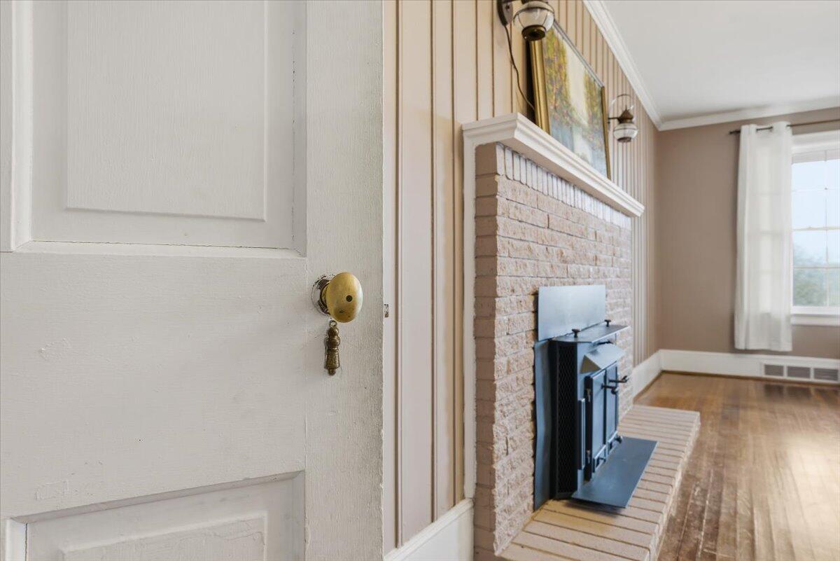 9419 Franklin Street Ferrum, VA 24088 - Photo 11 of 100 a view of a hallway with wooden floor and staircase