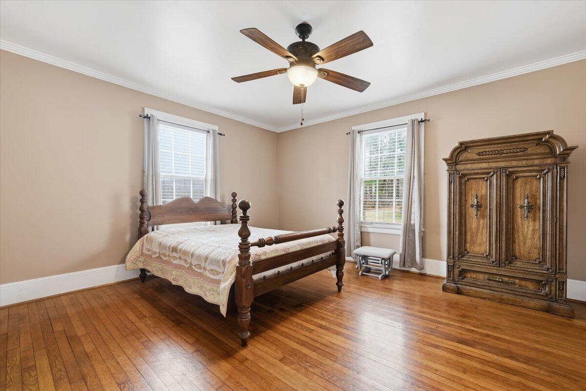 9419 Franklin Street Ferrum, VA 24088 - Photo 19 of 100 a bedroom with a bed and wooden floor