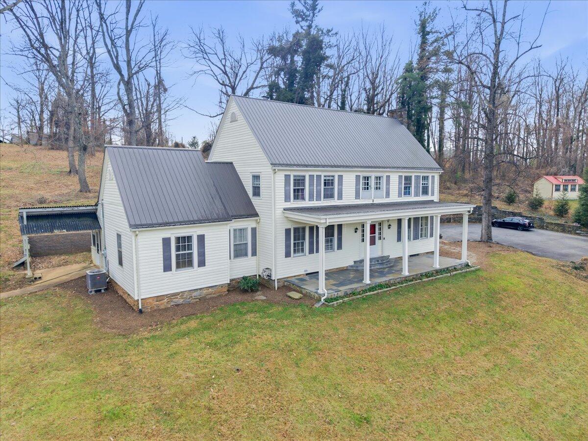 9419 Franklin Street Ferrum, VA 24088 - Photo 2 of 100 a view of a house with a yard and sitting area