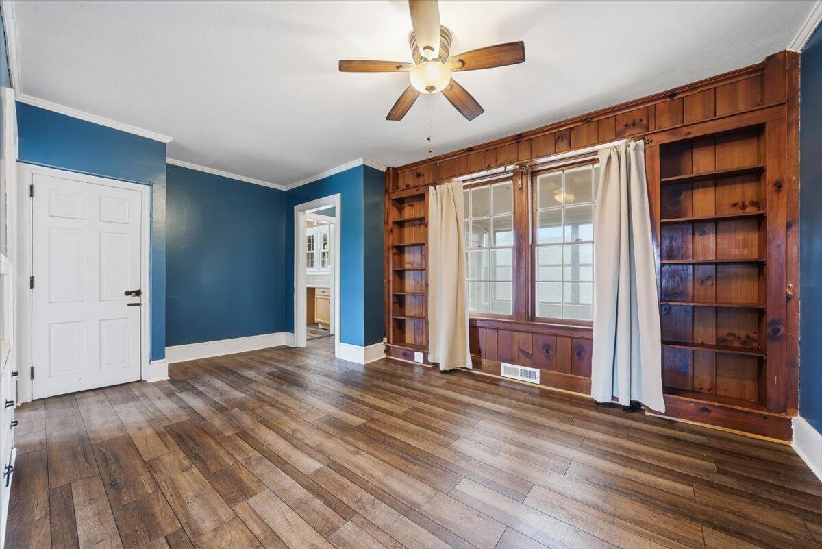 9419 Franklin Street Ferrum, VA 24088 - Photo 25 of 100 a view of an empty room with a window and wooden floor