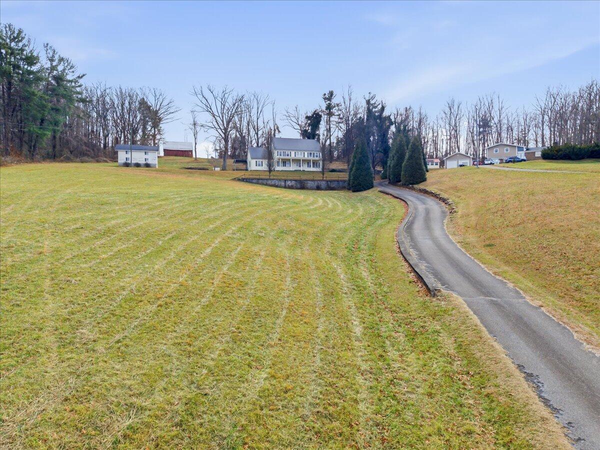 9419 Franklin Street Ferrum, VA 24088 - Photo 60 of 100 a swimming pool with trees in the background