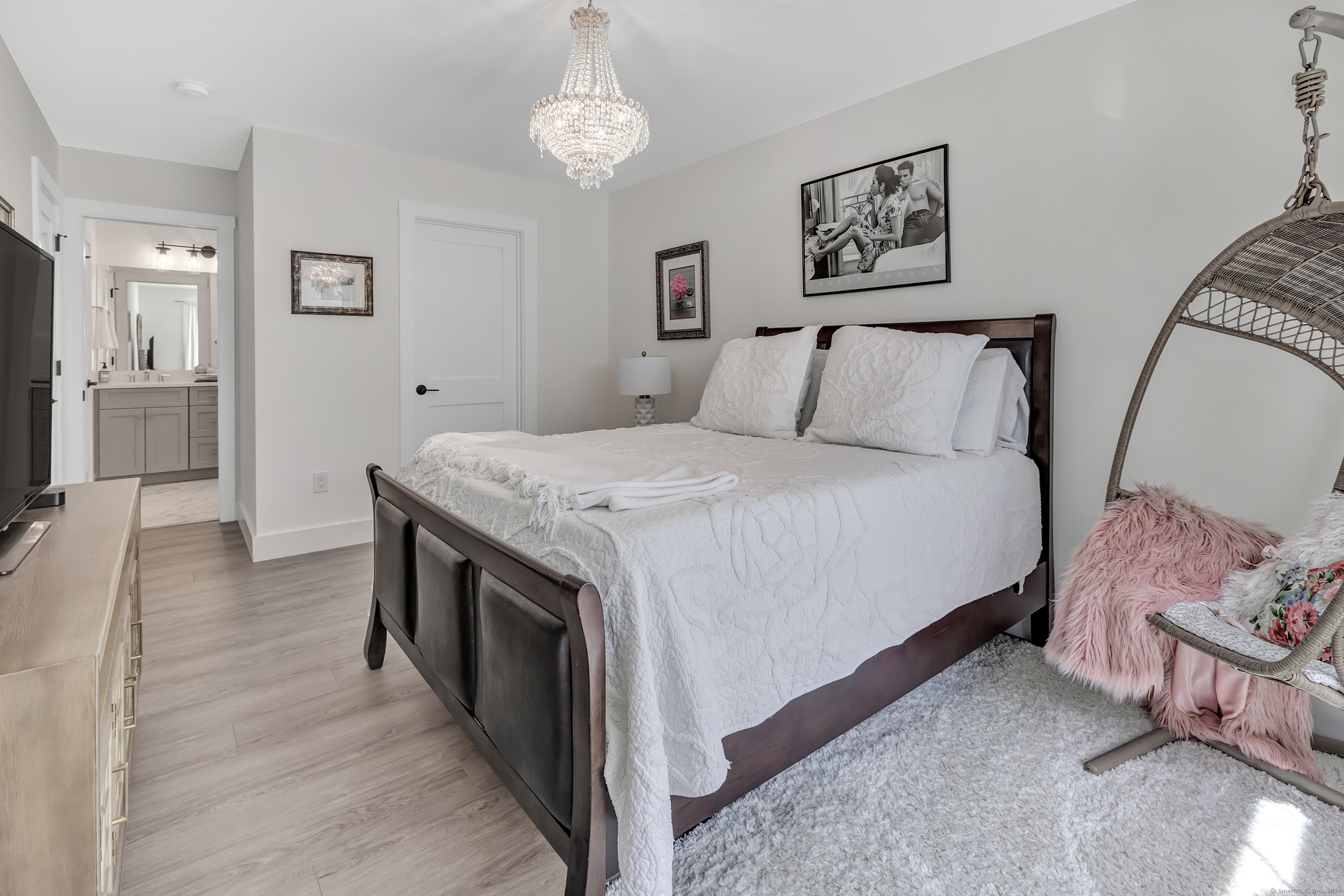 37 Old Rte 7, Unit 3 Brookfield, CT 06804 - Photo 27 of 39 a spacious bedroom with a bed and a chandelier