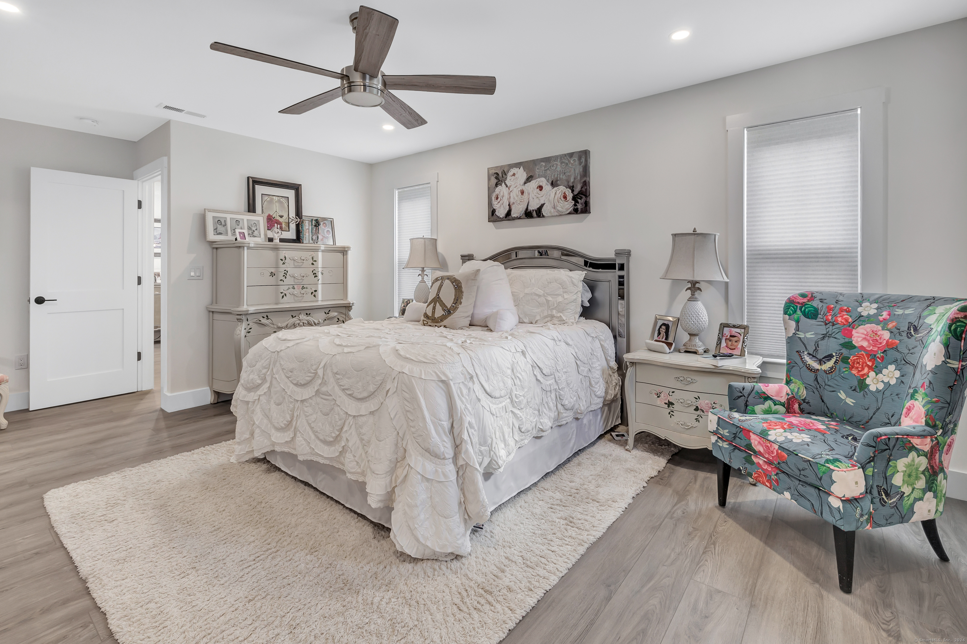 37 Old Rte 7, Unit 3 Brookfield, CT 06804 - Photo 32 of 39 a bedroom with a bed and a chandelier