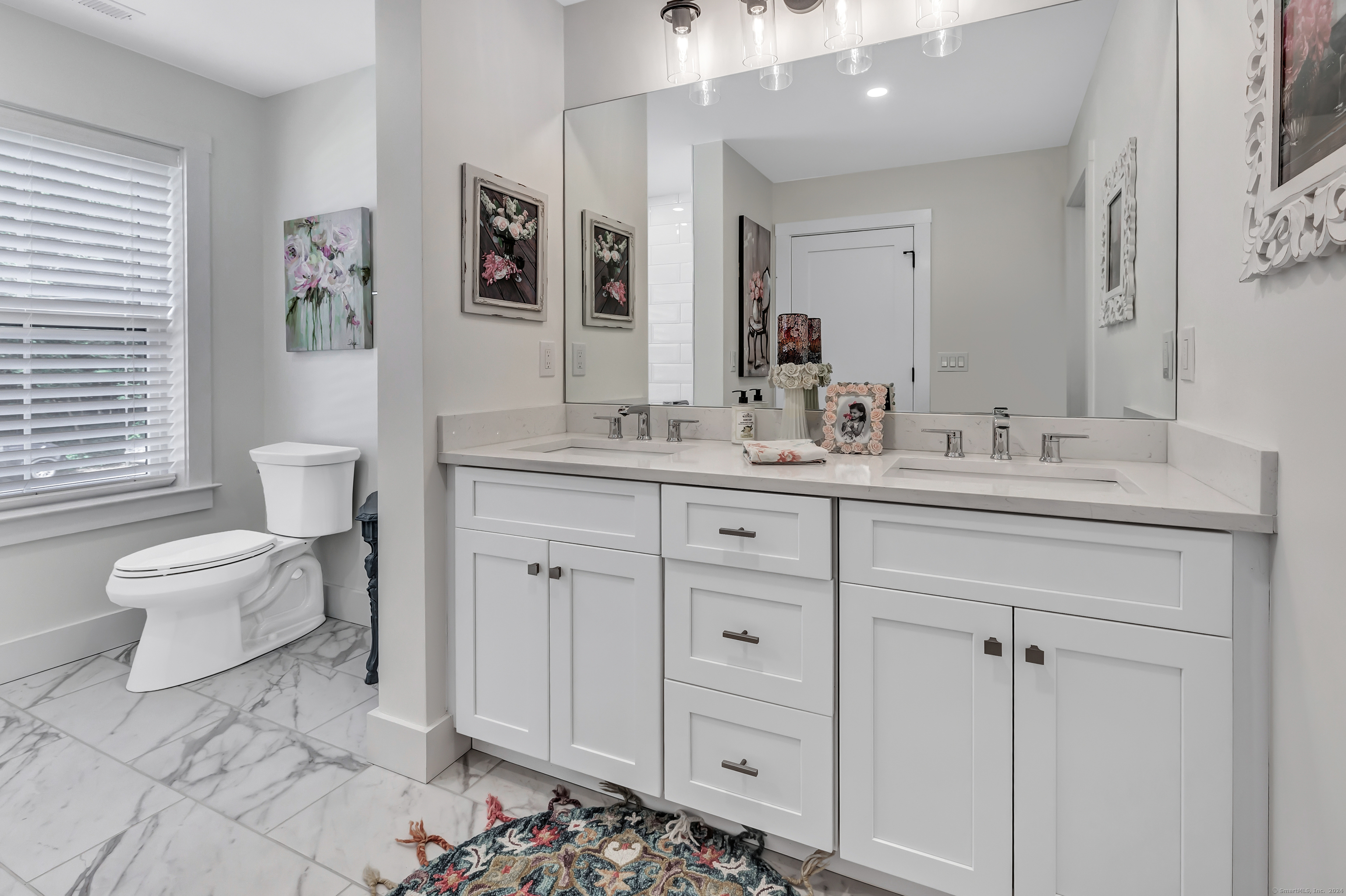37 Old Rte 7, Unit 3 Brookfield, CT 06804 - Photo 33 of 39 a spacious bathroom with a double vanity sink mirror and toilet
