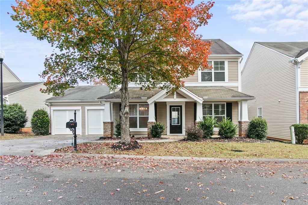 808 Inkberry Road Canton, GA 30114 - Photo 1 of 50 a front view of a house with a yard