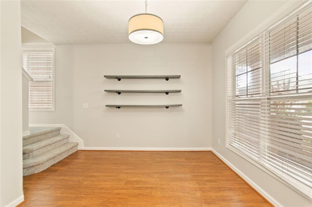 808 Inkberry Road Canton, GA 30114 - Photo 11 of 50 a view of a room with rack on the wall and a window
