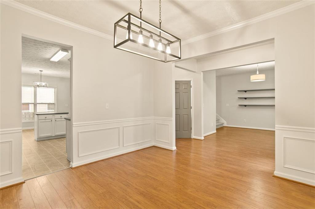 808 Inkberry Road Canton, GA 30114 - Photo 14 of 50 a view of empty room with wooden floor