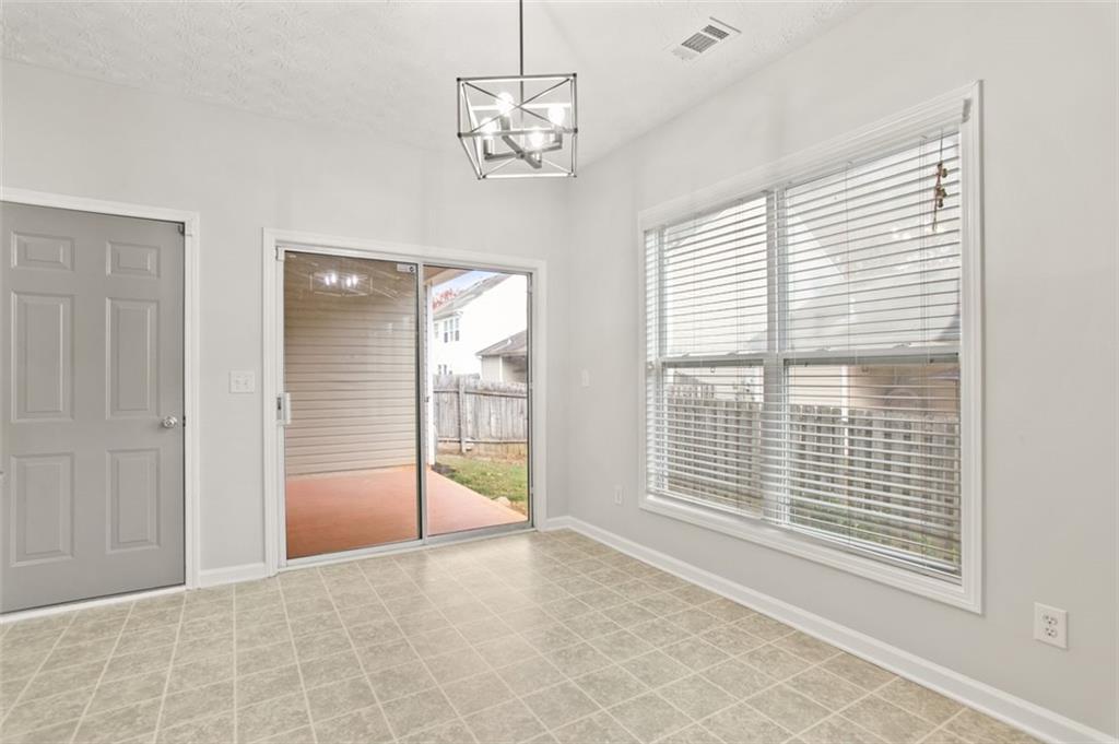 808 Inkberry Road Canton, GA 30114 - Photo 19 of 50 a view of an empty room with a window