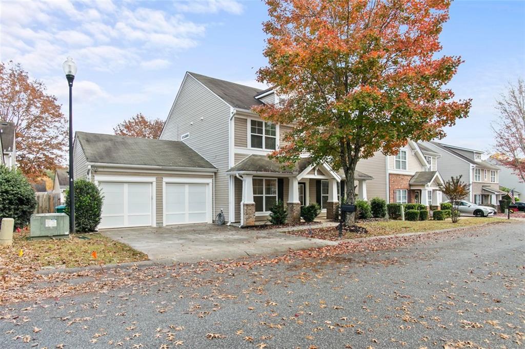 808 Inkberry Road Canton, GA 30114 - Photo 2 of 50 a front view of a house with a yard
