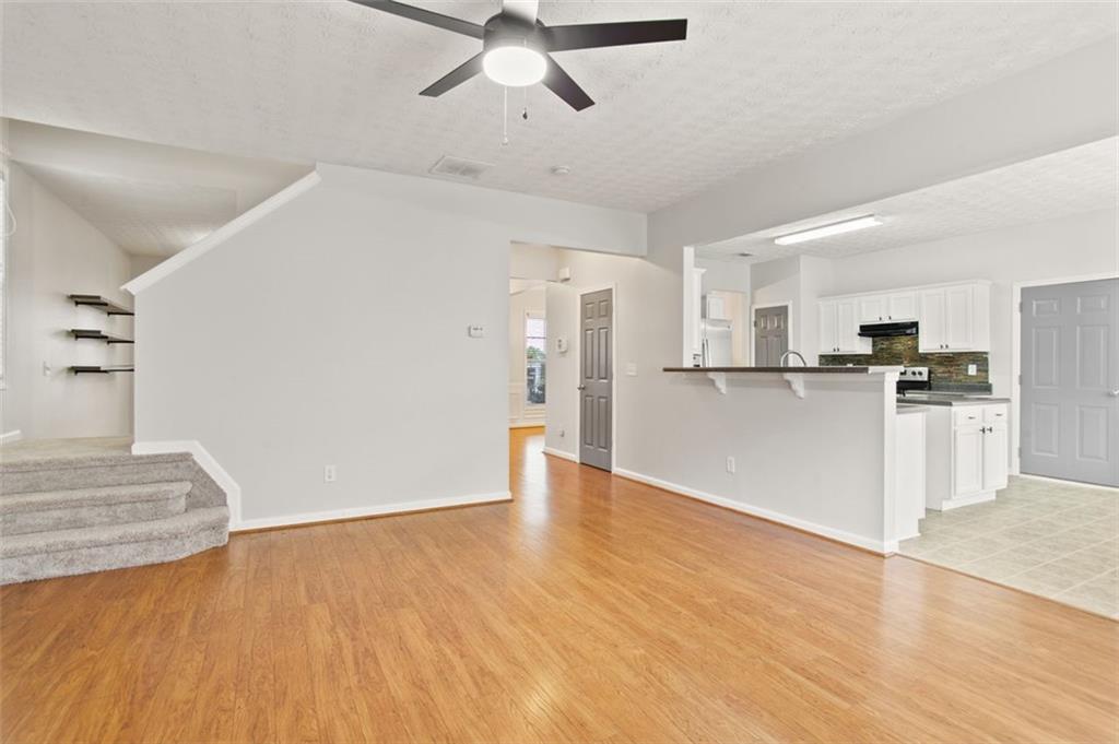 808 Inkberry Road Canton, GA 30114 - Photo 24 of 50 a view of a kitchen with a sink and a refrigerator