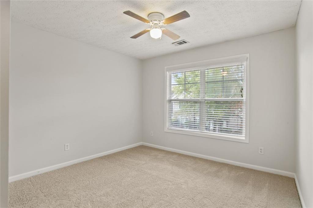 808 Inkberry Road Canton, GA 30114 - Photo 25 of 50 a view of an empty room with a window