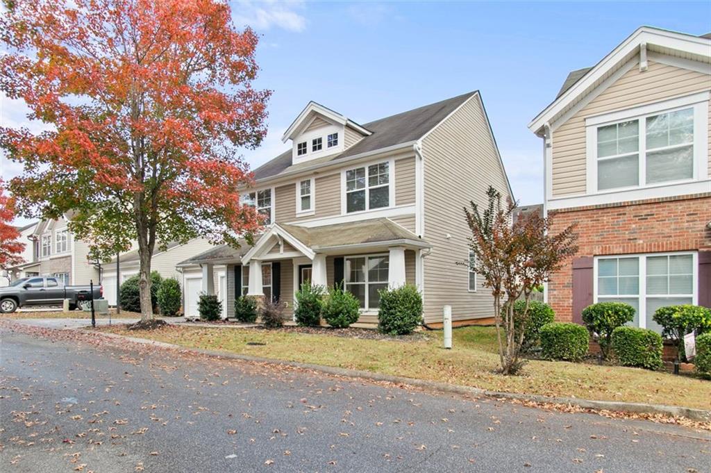 808 Inkberry Road Canton, GA 30114 - Photo 3 of 50 a front view of a house with a yard