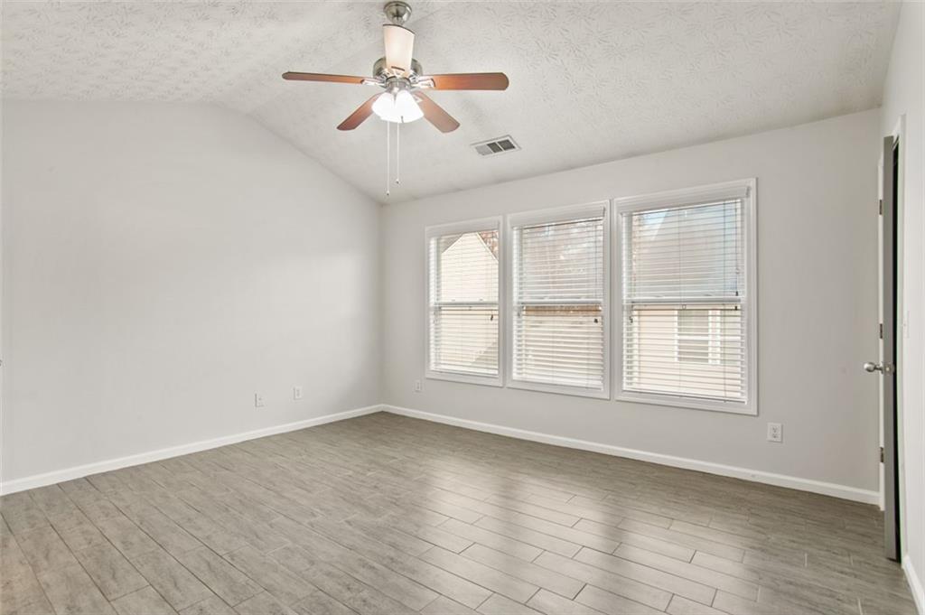 808 Inkberry Road Canton, GA 30114 - Photo 31 of 50 wooden floor in an empty room with a window