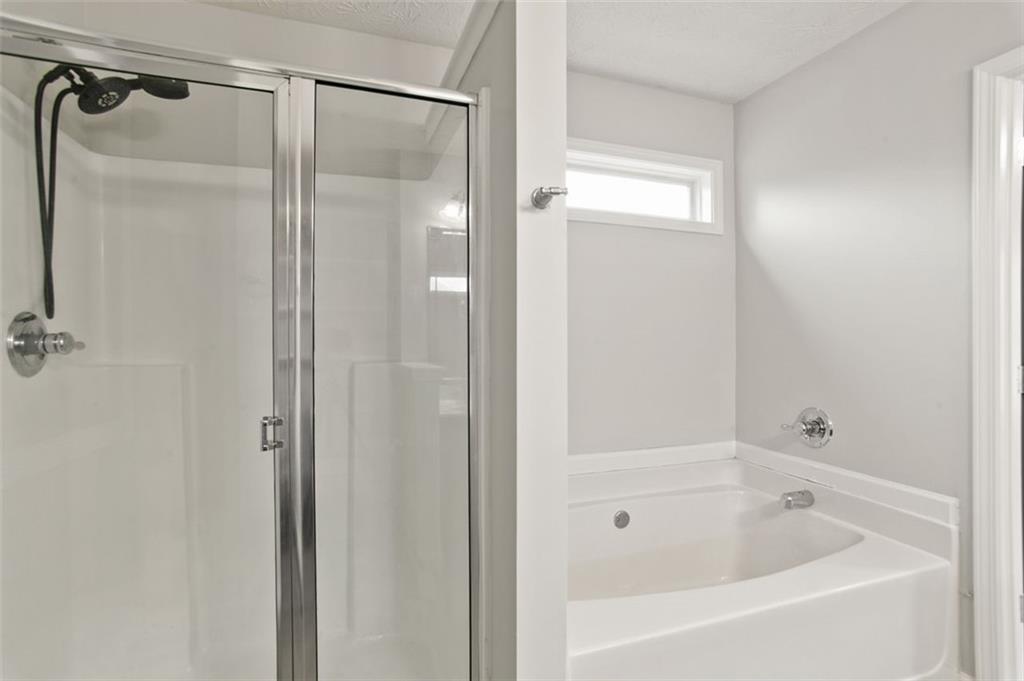 808 Inkberry Road Canton, GA 30114 - Photo 34 of 50 a bathroom with a bathtub