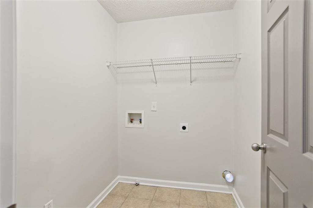 808 Inkberry Road Canton, GA 30114 - Photo 37 of 50 a view of a room with racks on the wall