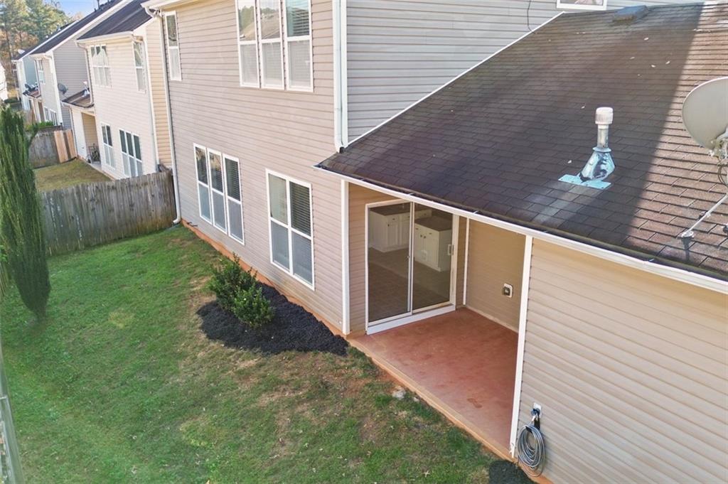 808 Inkberry Road Canton, GA 30114 - Photo 41 of 50 a view of a house with a backyard