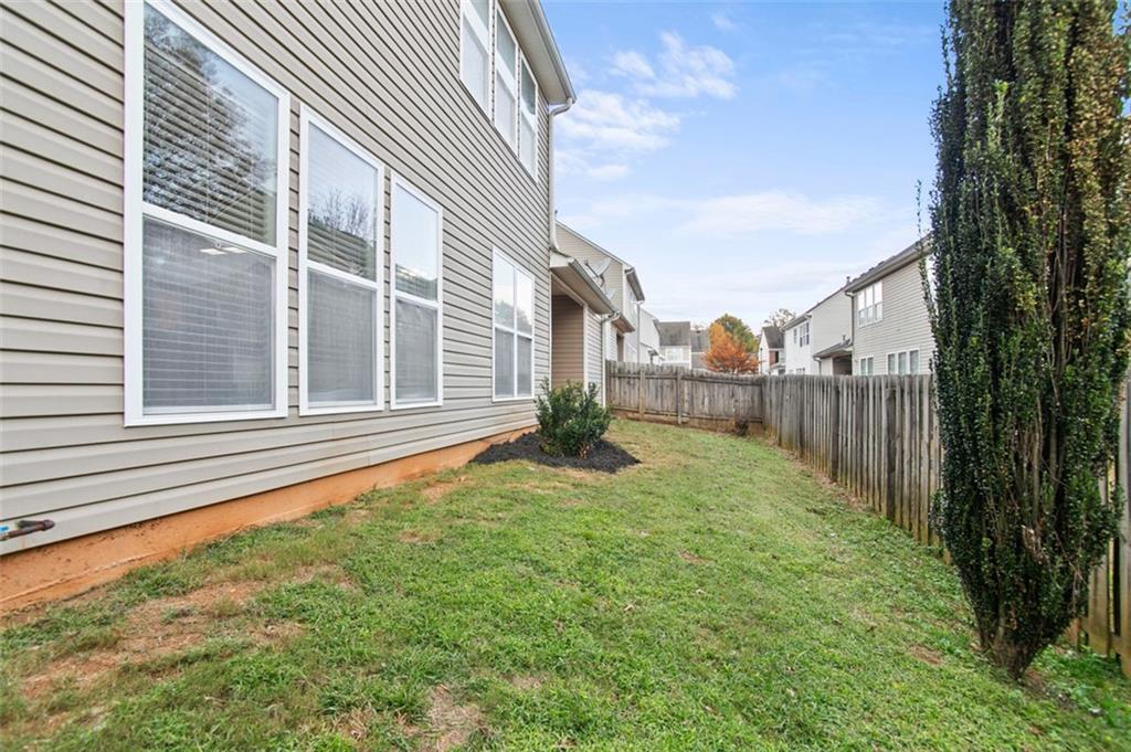 808 Inkberry Road Canton, GA 30114 - Photo 42 of 50 a view of backyard with trampoline