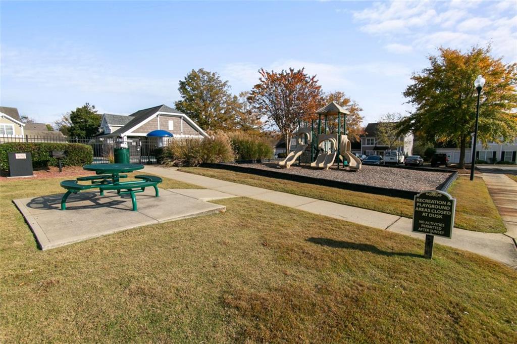 808 Inkberry Road Canton, GA 30114 - Photo 48 of 50 a view of a patio with swimming pool and sitting area