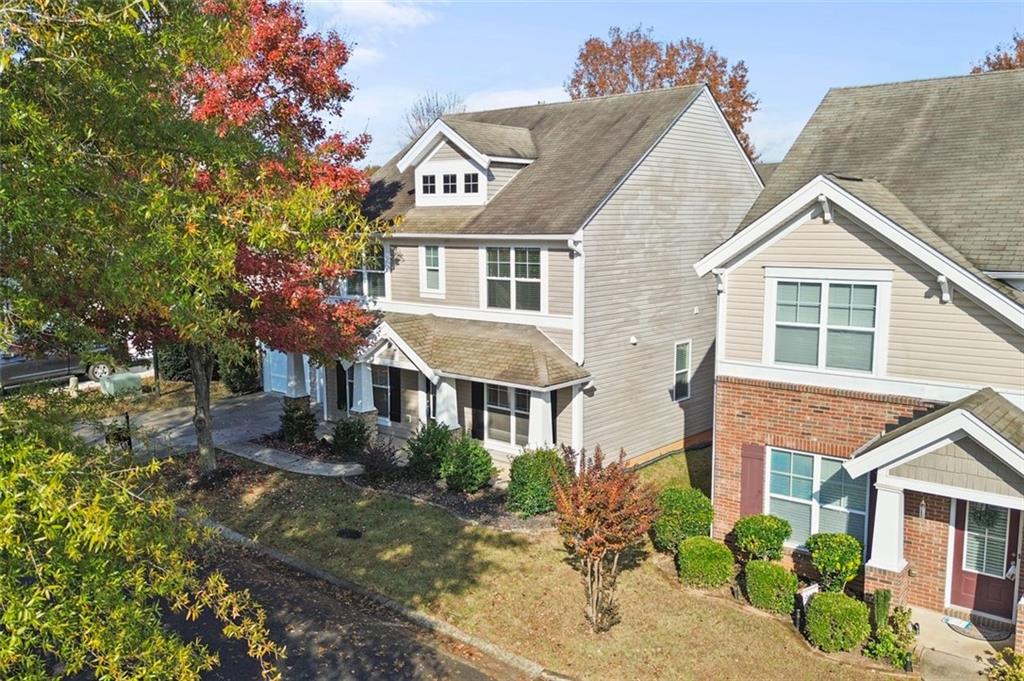 808 Inkberry Road Canton, GA 30114 - Photo 6 of 50 a front view of a house with a yard and potted plants