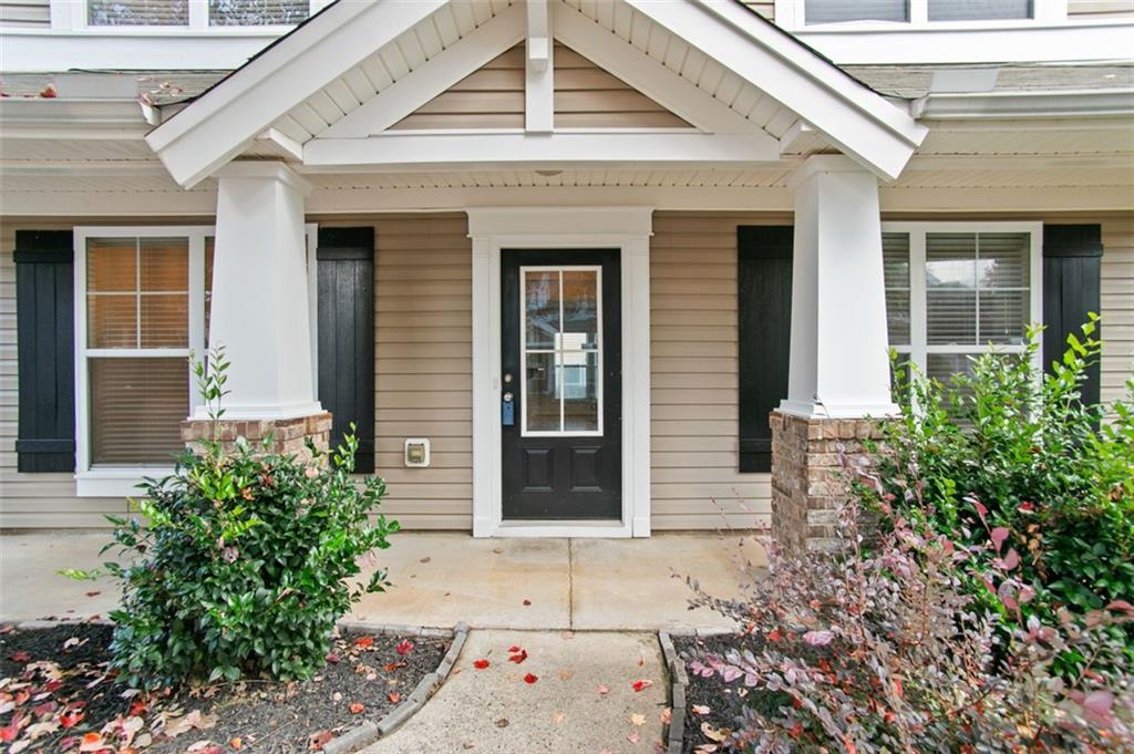 808 Inkberry Road Canton, GA 30114 - Photo 9 of 50 a front view of a house with a garage