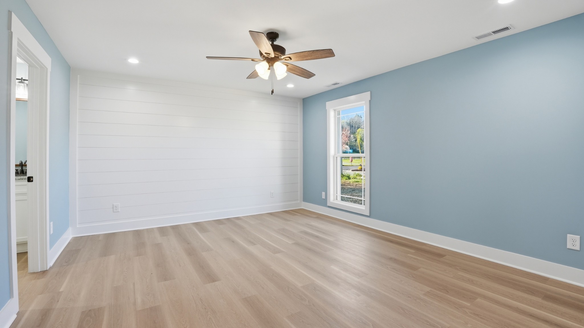 104 Division Street Normandy, TN 37360 - Photo 15 of 48 wooden floor in an empty room with a window