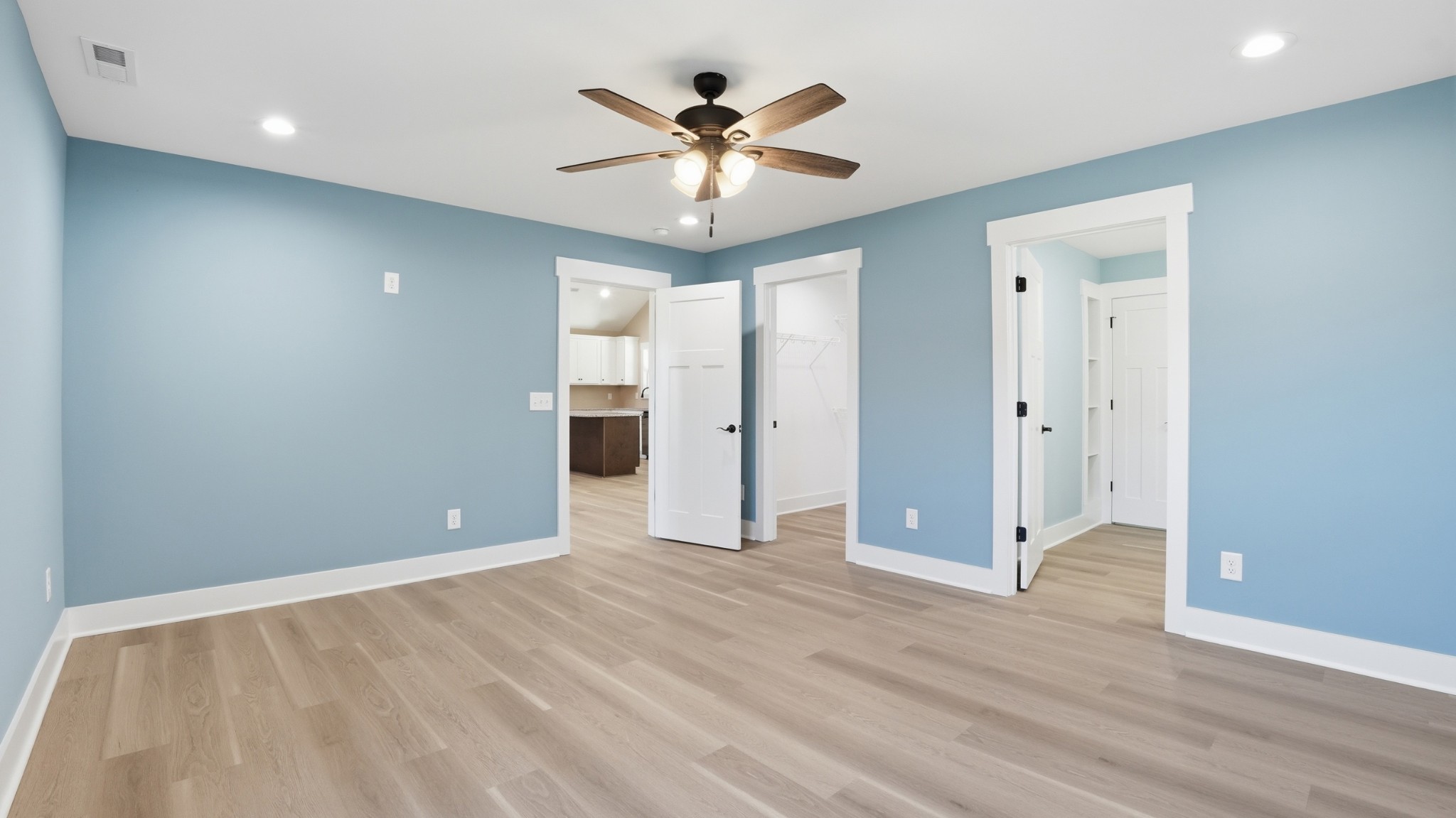 104 Division Street Normandy, TN 37360 - Photo 18 of 48 wooden floor in an empty room with a ceiling fan
