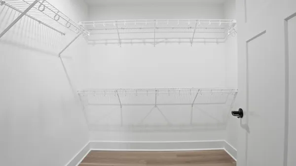 a bathroom with double vanity sinks and a mirror